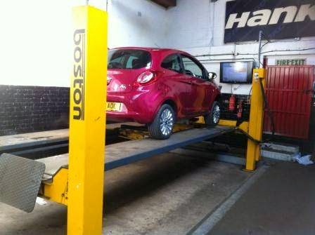 A car up on the ramp in the Nuneaton Exhaust Centre bay